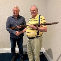 Jim Gaskins ,FLSSAR Sr. VP, holding the Pennsylvania Long Rifle he won. He is with a friend, former FLSSAR President Ray Wess of the Palm Beach SAR.